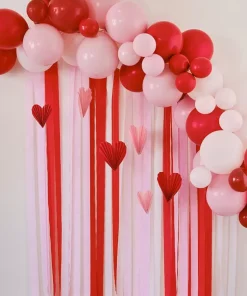 Σύνθεση από μπαλόνια Valentine’s κόκκινα/ροζ/παστέλ ροζ με χάρτινες βεντάλιες καρδιά & κορδέλες κρεπ
